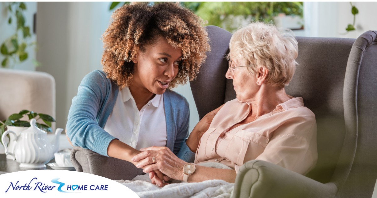 A caregiver warmly reassures an older client, showing the kind of attitude that can help clients get used to new care arrangements.