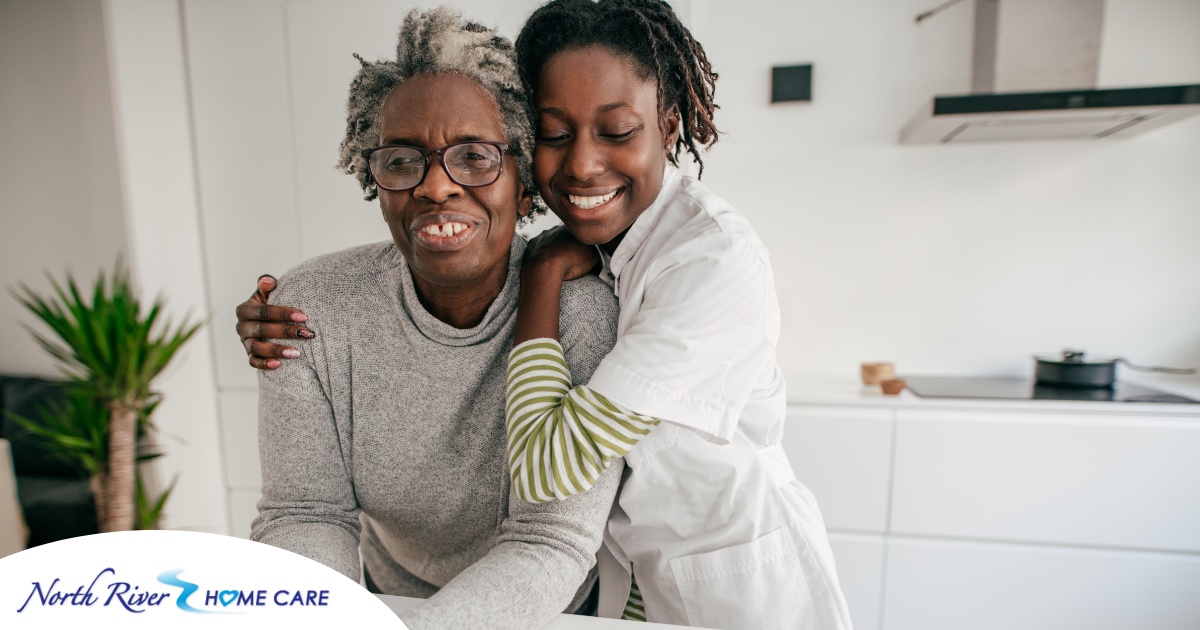 A caregiver hugs a client, representing the science of caregiving and how latest research can help provide quality care.