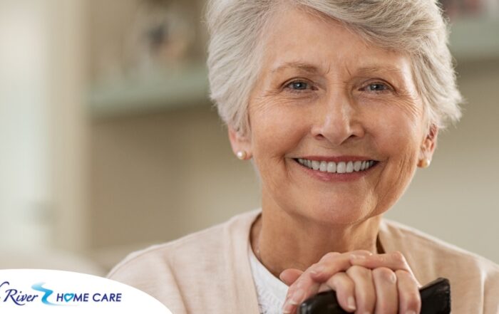 An older woman with healthy teeth smiles, representing good dental hygiene.