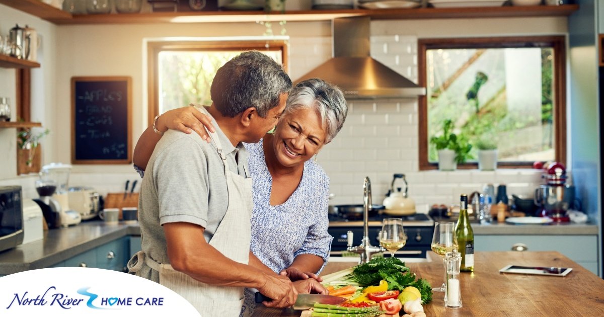 An older couple prepares healthy food together representing National Nutrition Month.