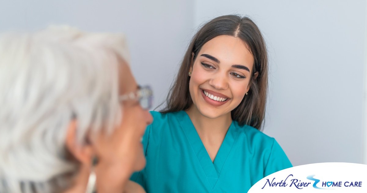 A caregiver smiles with an older client showing the results of successfully starting a new caregiving job.