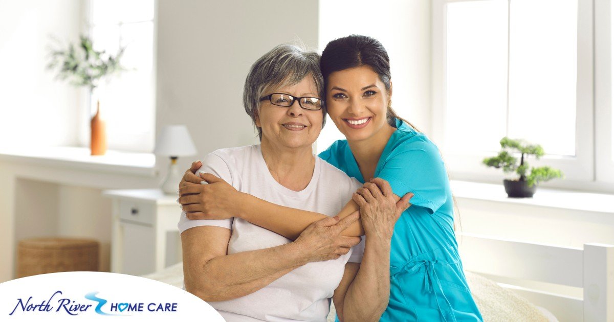 A caregiver hugs an older client, representing how a trustworthy caregiver cares for clients.