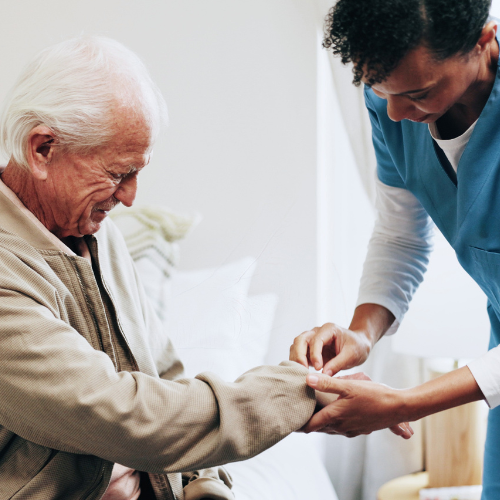 Square Images for Home Page 500 x 500 (1) professional caregiver helping senior client get dressed
