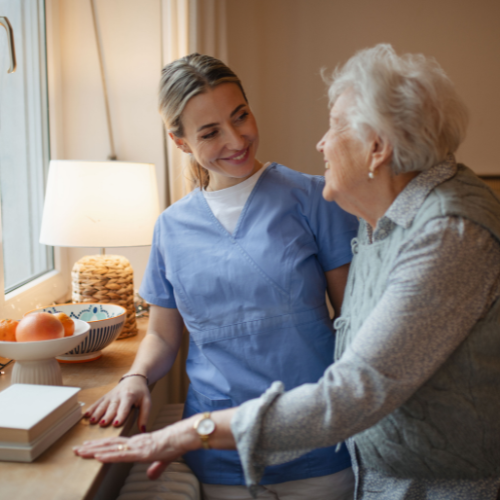 Square Images for Home Page 500 x 500 (5) home caregiver helping senior client in kitchen